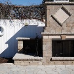 Custom outdoor fireplace build in Monaco Wall by Permacon 