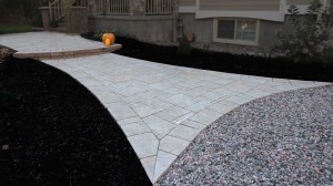 Yard makeover with antique effect chiselled interlock paving